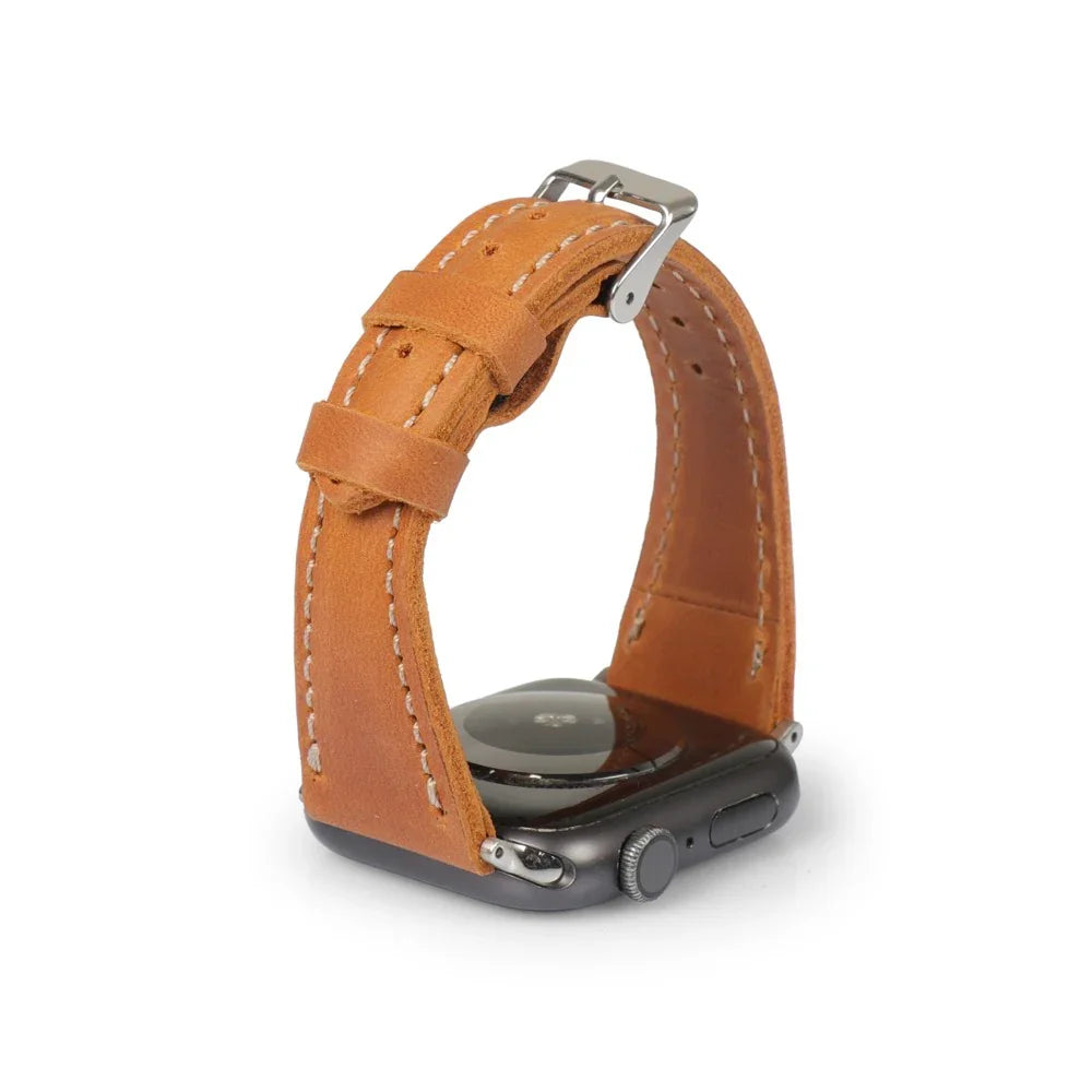 Camel brown full-grain leather Apple Watch strap with white stitching and silver buckle