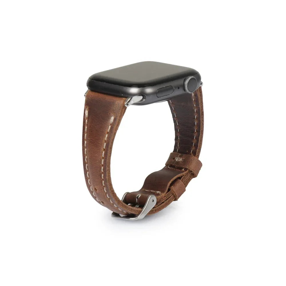 Brown full-grain leather Apple Watch strap with stitching and metal buckle on white background