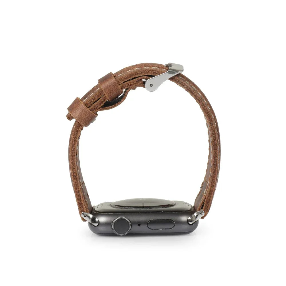 Tan leather Apple Watch strap with metal clasp, shown on a black smartwatch